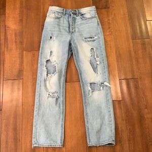 light blue jeans with holes